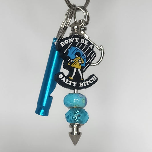 Keychain with whistle and 'Don't Be Salty Bitch' charm on a white background