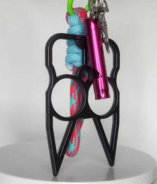 Black safety keychain with pink whistle and colorful rope on a white background