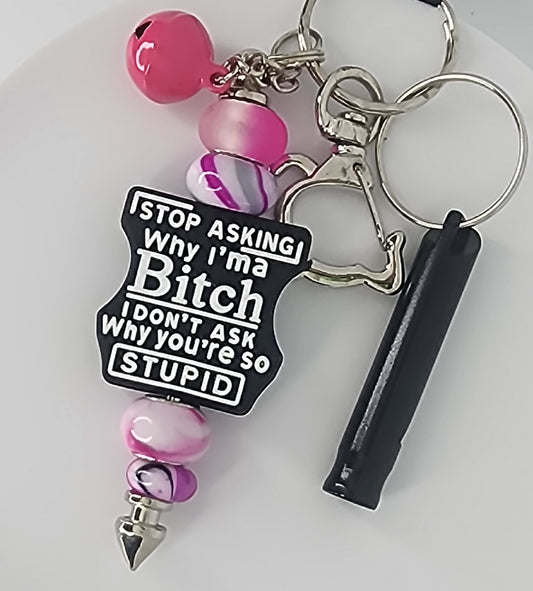 Keychain with pink and purple beads and a black focal bead that says Stop Asking Why I'm a Bitch, I don't Ask Why You're So Stupid on a white background